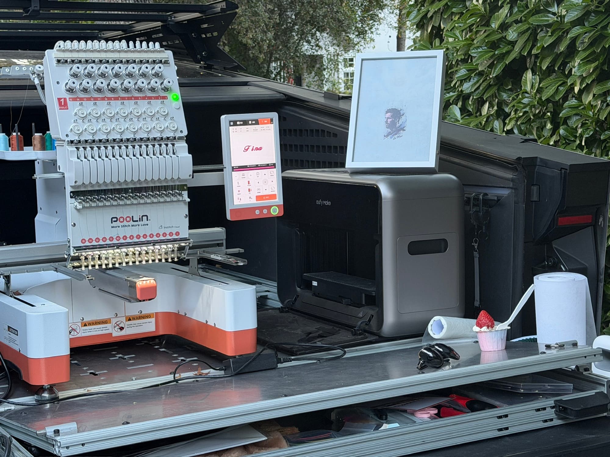 The machine, stitching out of the truck bed
